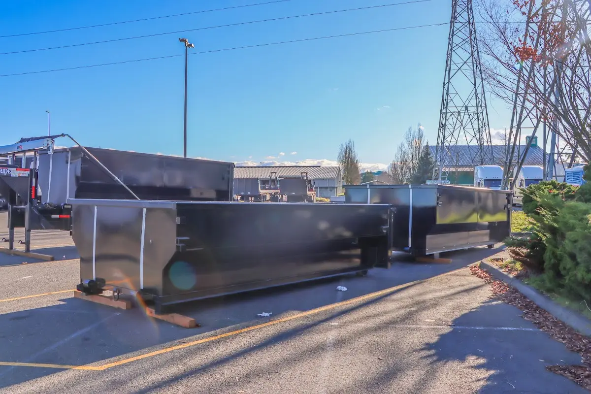 Roll-off dumpster ready for waste disposal at job site for Commercial Dumpster Rental in Rainbow City